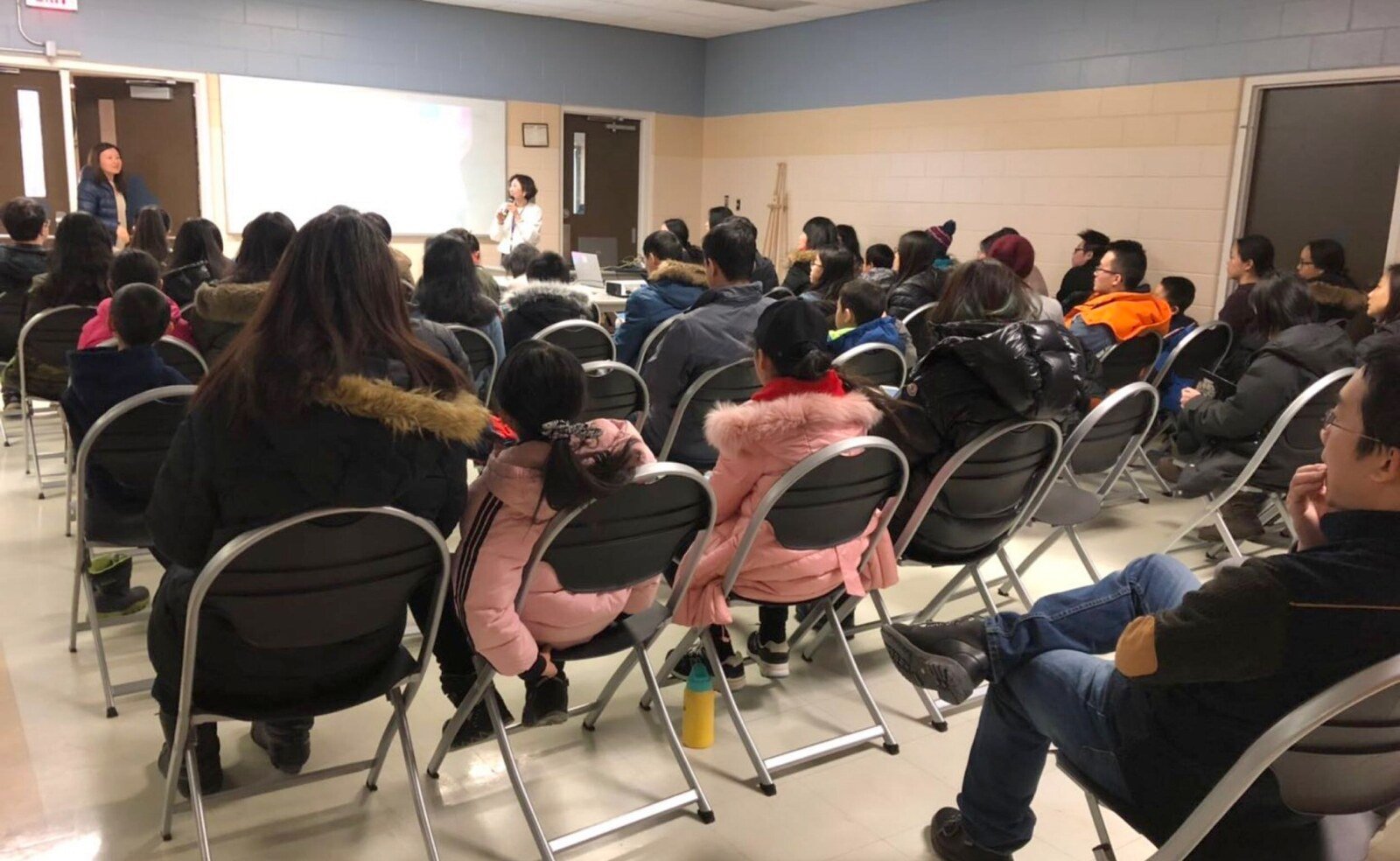 A community learning session attended by families and young people