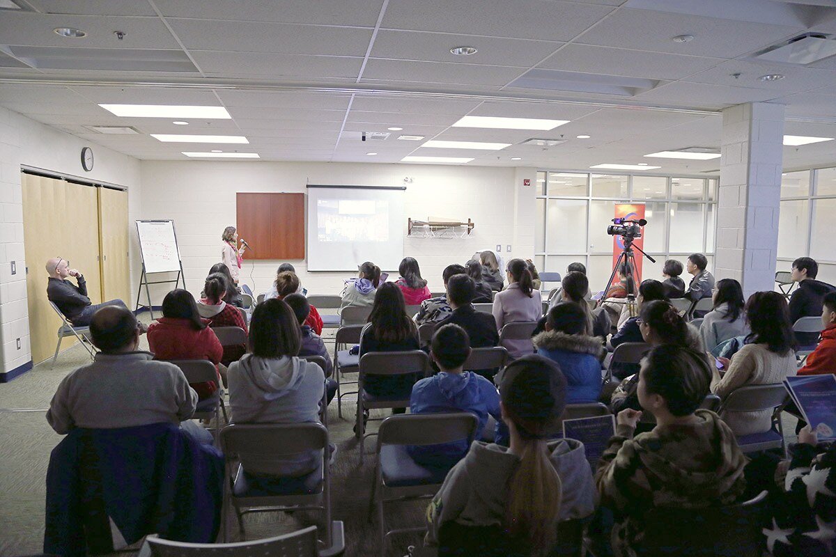 A community learning session with families and young participants