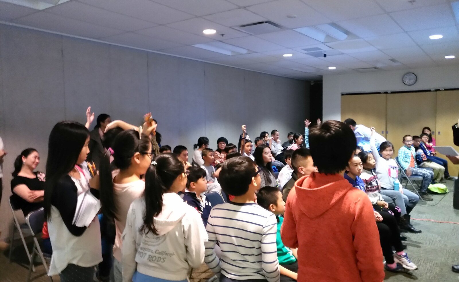 Families and young people taking part in an interactive activity